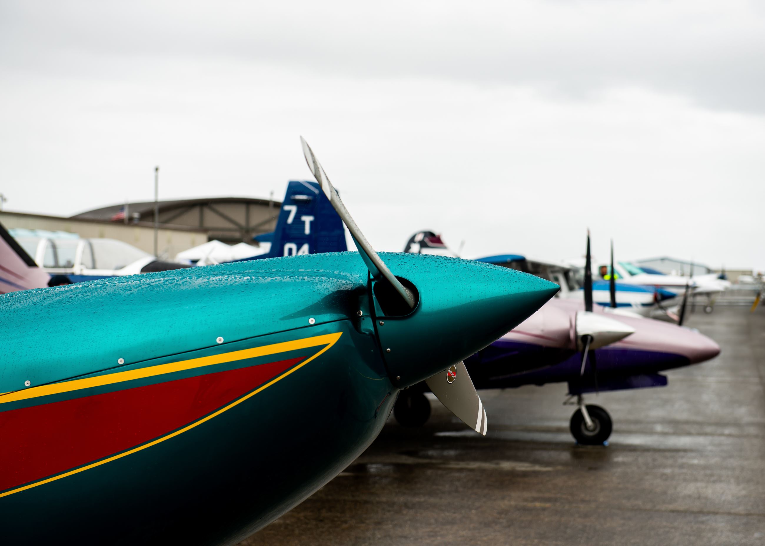 Paine Field community day general aviation plane painted in teal and maroon